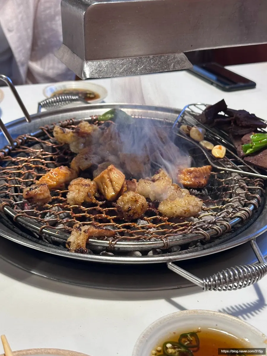 Hood and smoke above the grill