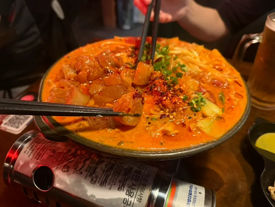 Wide tudoufen noodles coated in rosé mala sauce
