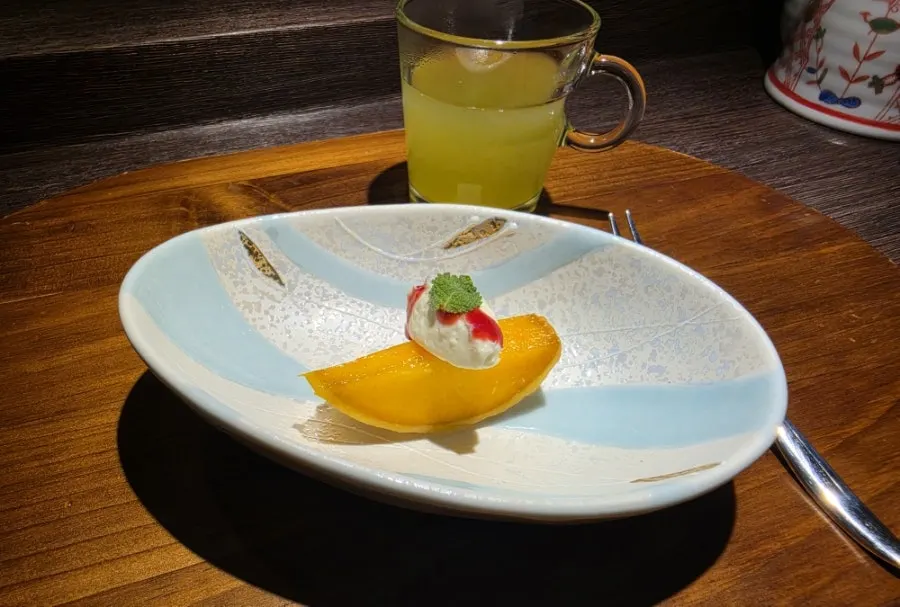 Yellow peach dessert and green tea to finish Danya's course