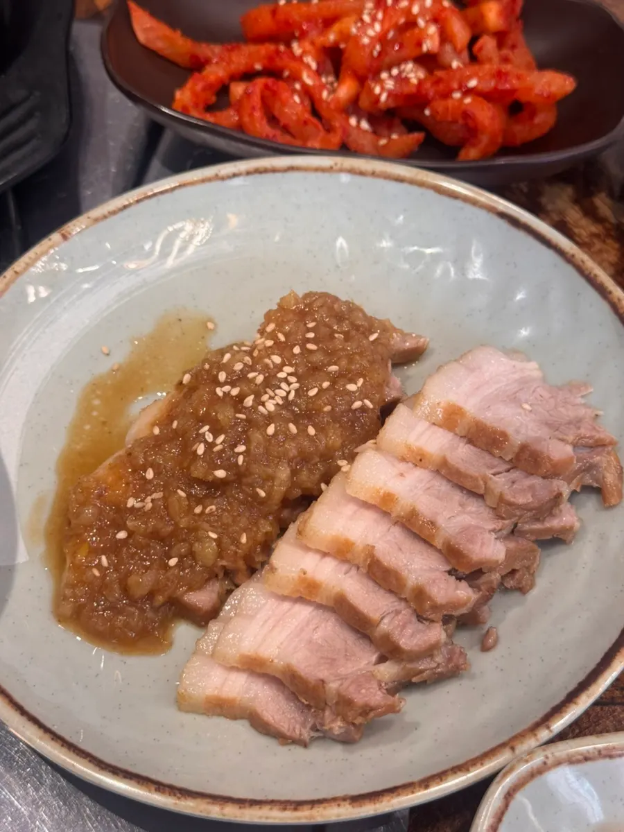 Black garlic suyuk topped with black garlic sauce