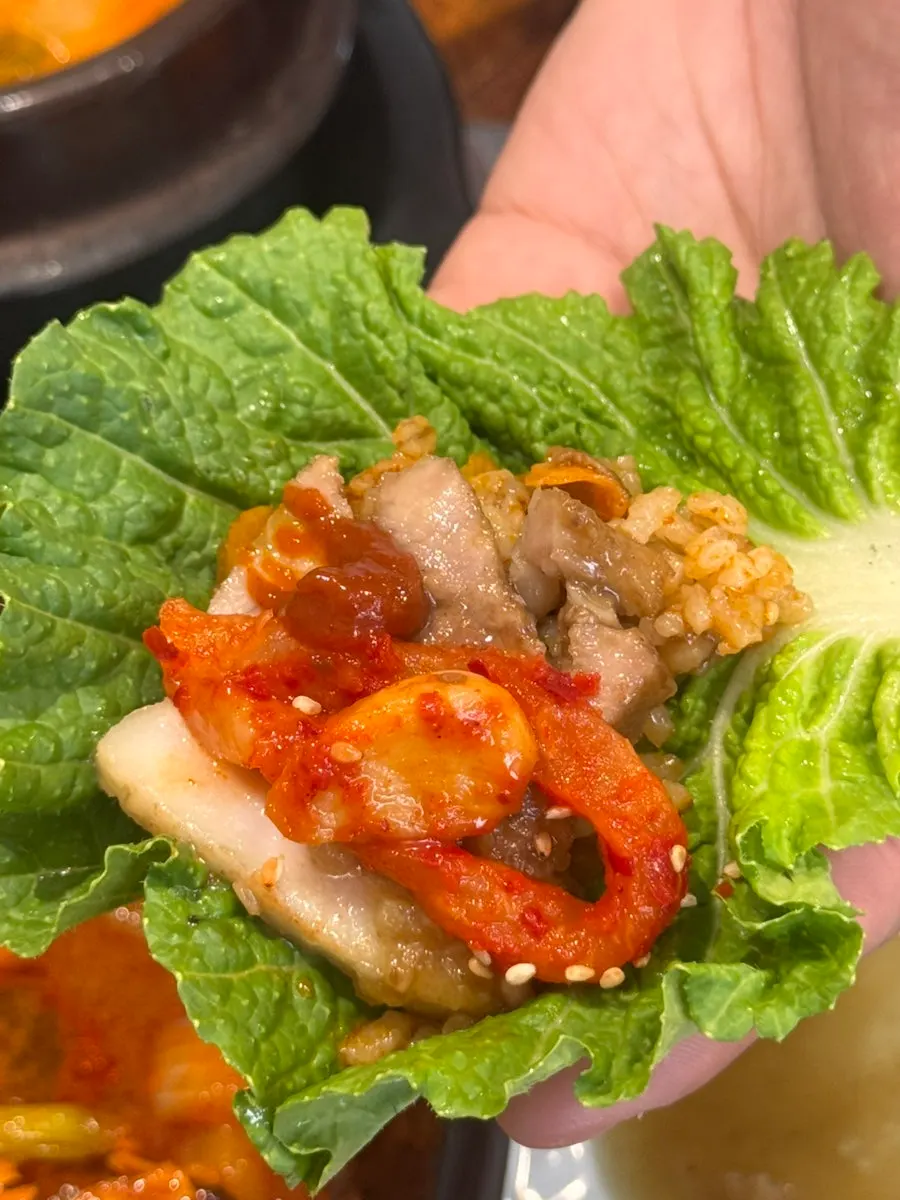 Black garlic suyuk wrapped with bossam kimchi