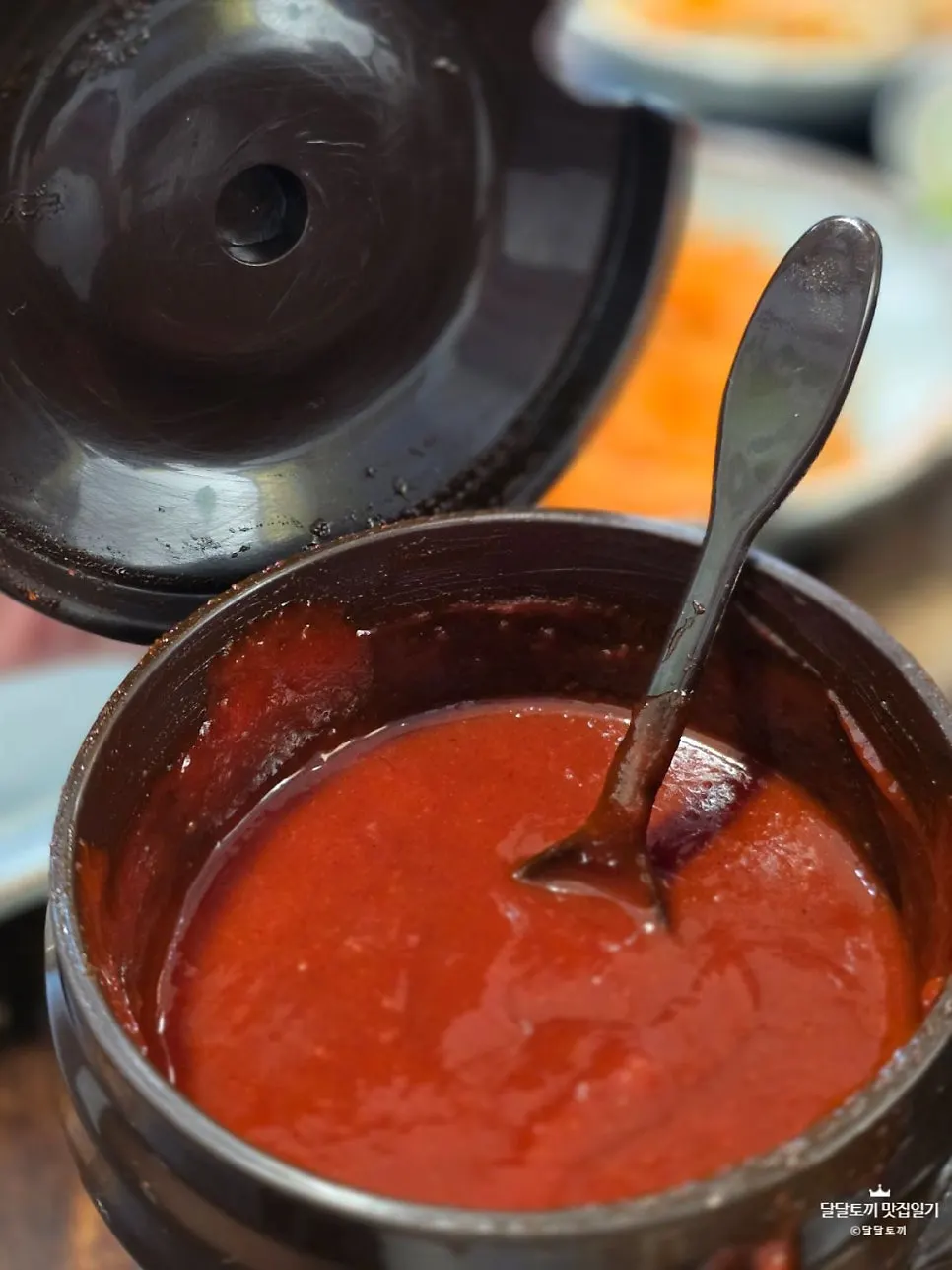 A generous spoonful of gochujang added onto the bibimbap