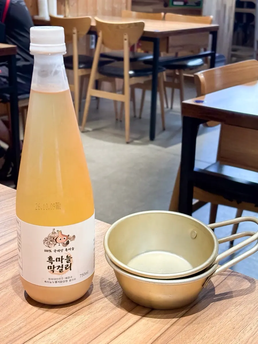 Black garlic makgeolli ordered with boiled pork