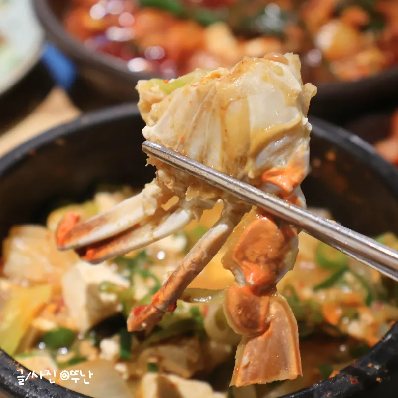 Spooning up the doenjang stew broth