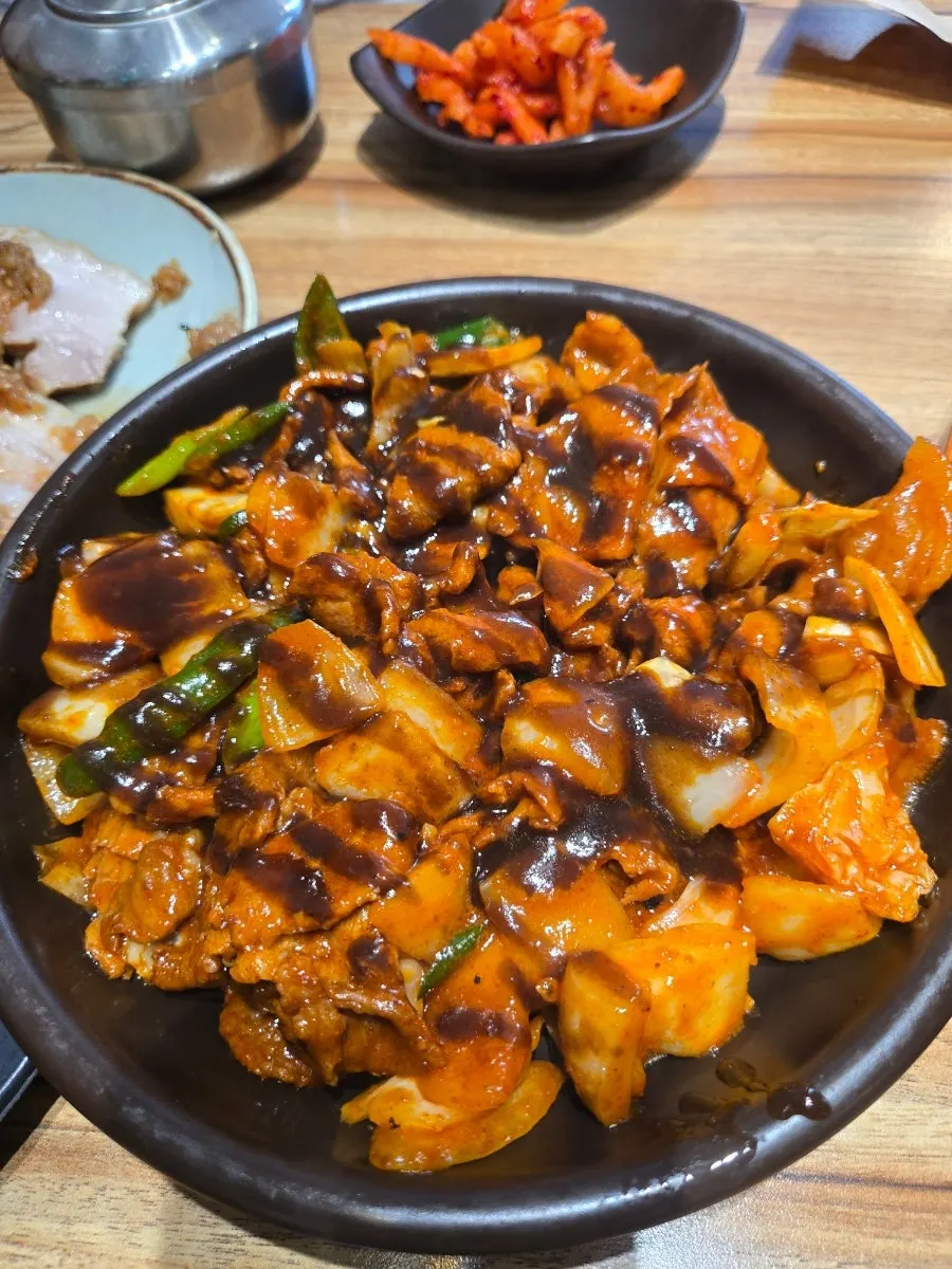 Plate of tender black garlic boiled pork