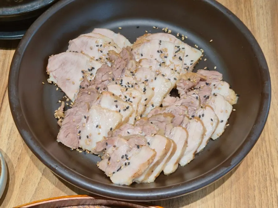 Plate of black garlic boiled pork
