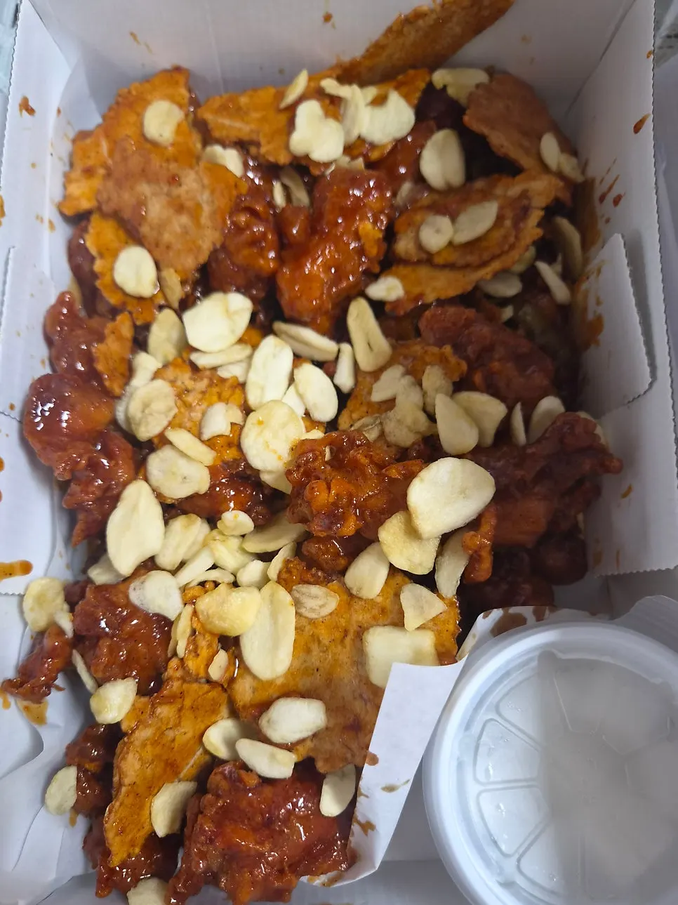 Dakgangjeong with nurungji and garlic flakes