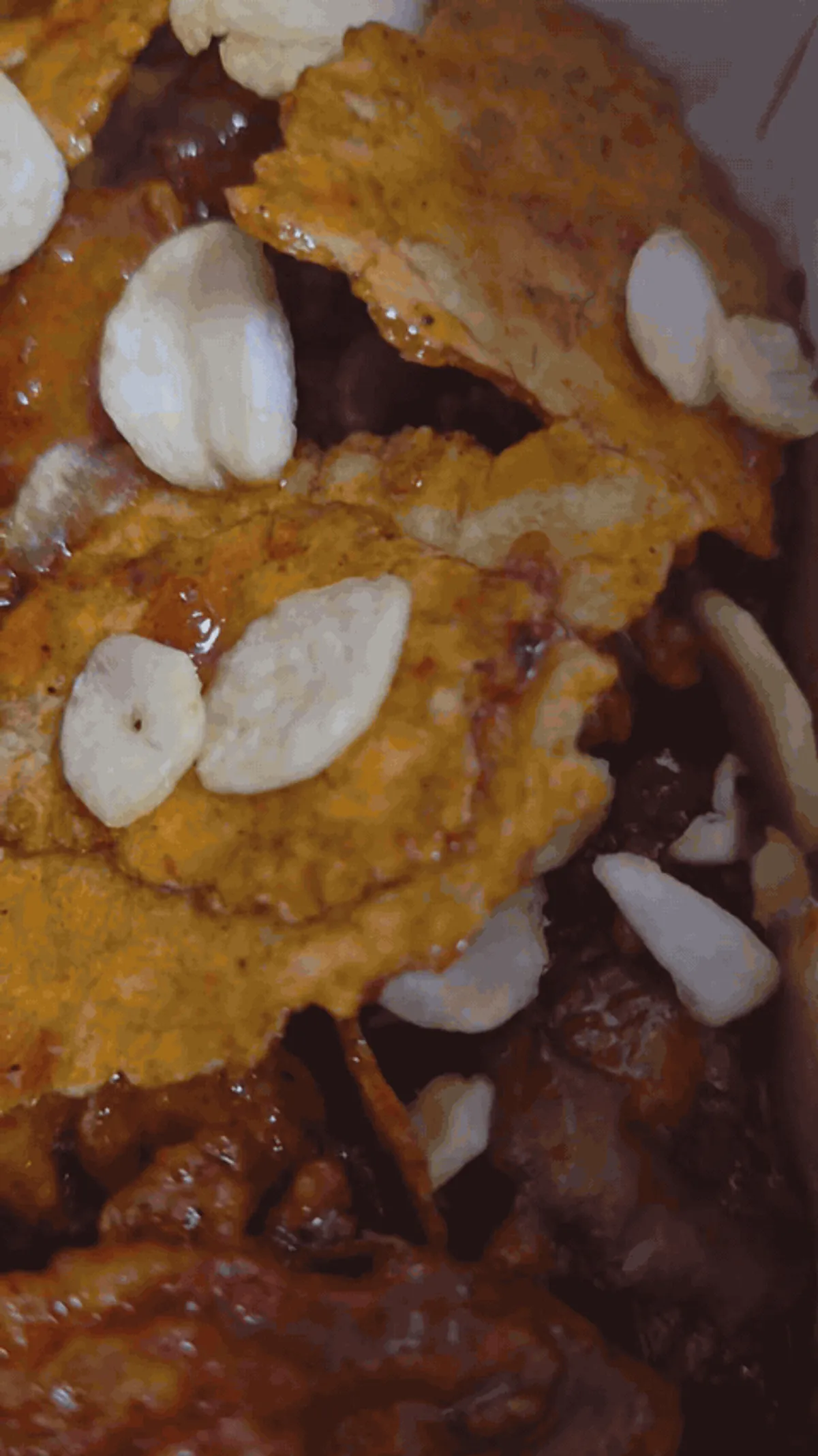 Dakgangjeong served with nurungji and garlic flakes