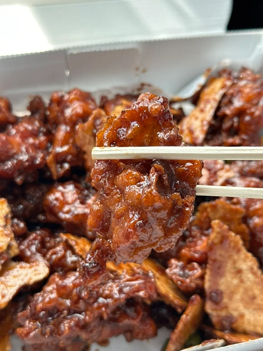 Black garlic dakgangjeong with thick sticky sauce