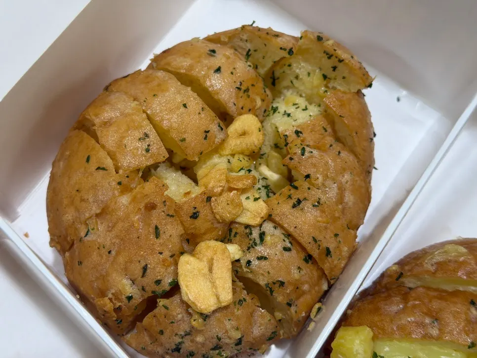 A piece of the basic garlic bread baguette