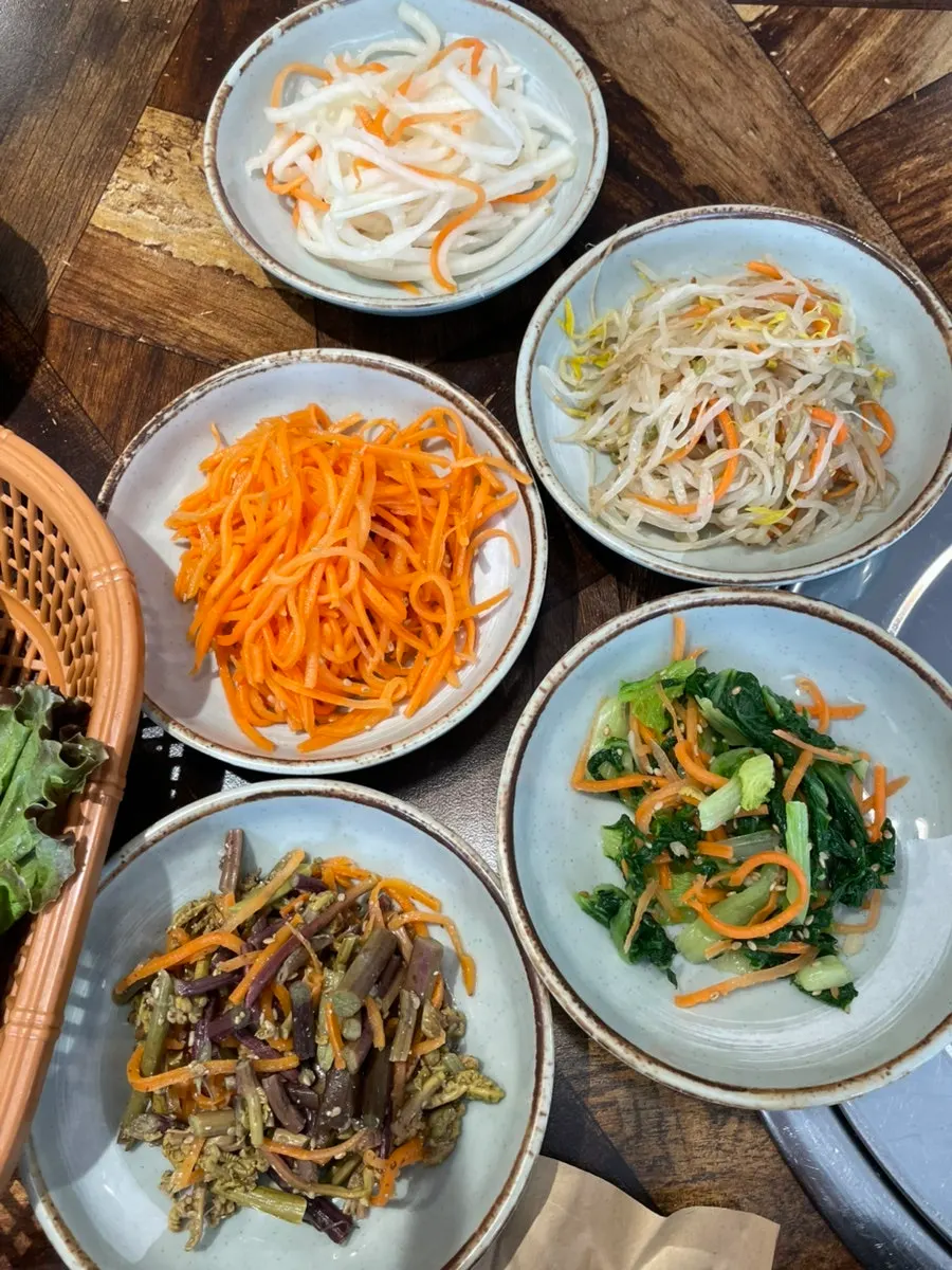 A spread of many banchan side dishes