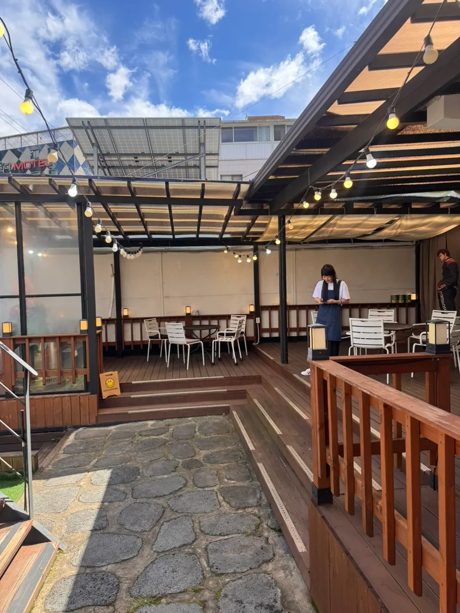 Outdoor terrace seating on JB Coffee's first floor