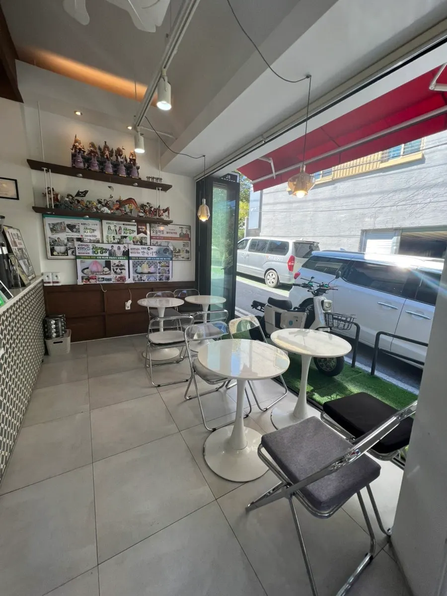 Figurines displayed on one wall of JB Coffee