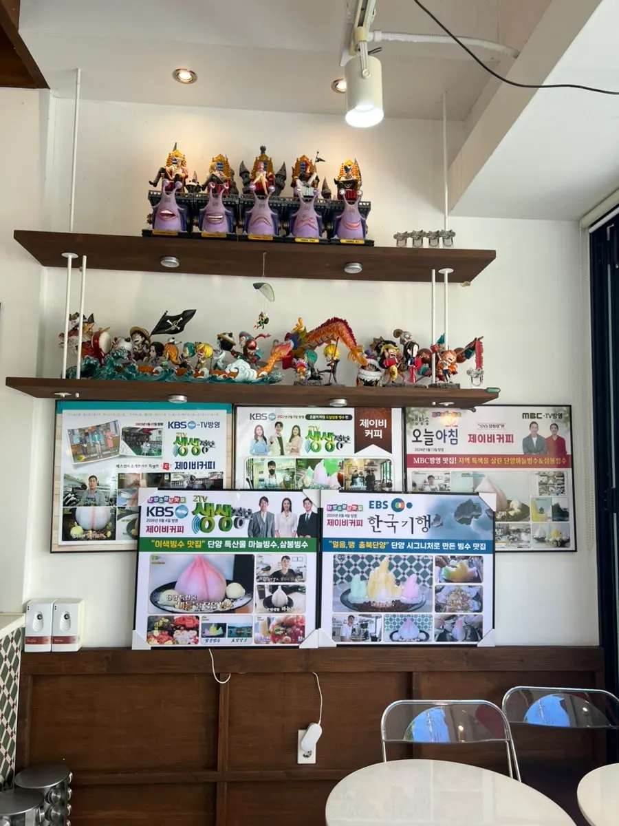 Figurine display case area at JB Coffee