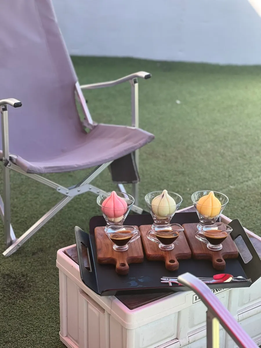 Espresso served separately alongside the garlic-shaped dessert