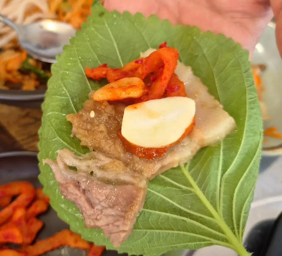 Close-up of black garlic boiled pork meat