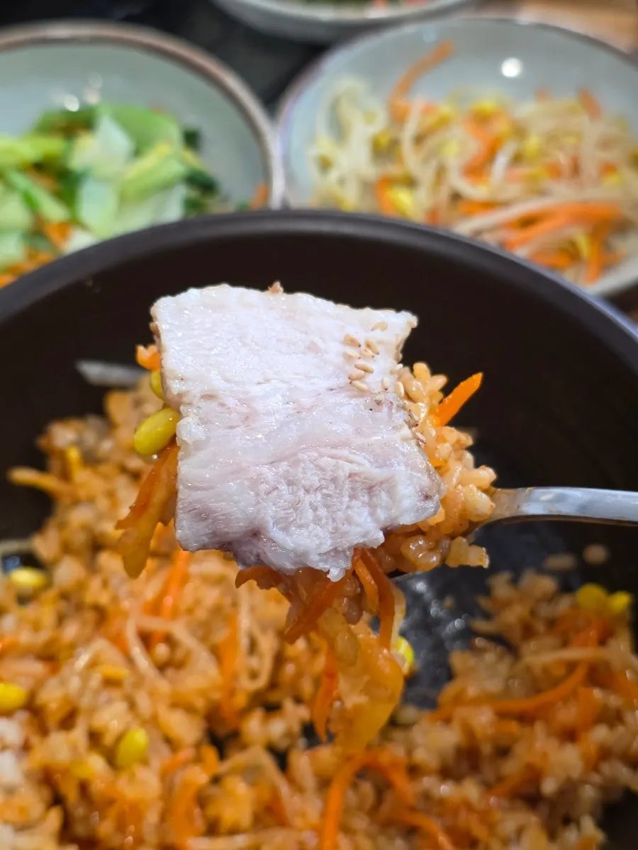 A bowl of barley rice mixed with side dishes