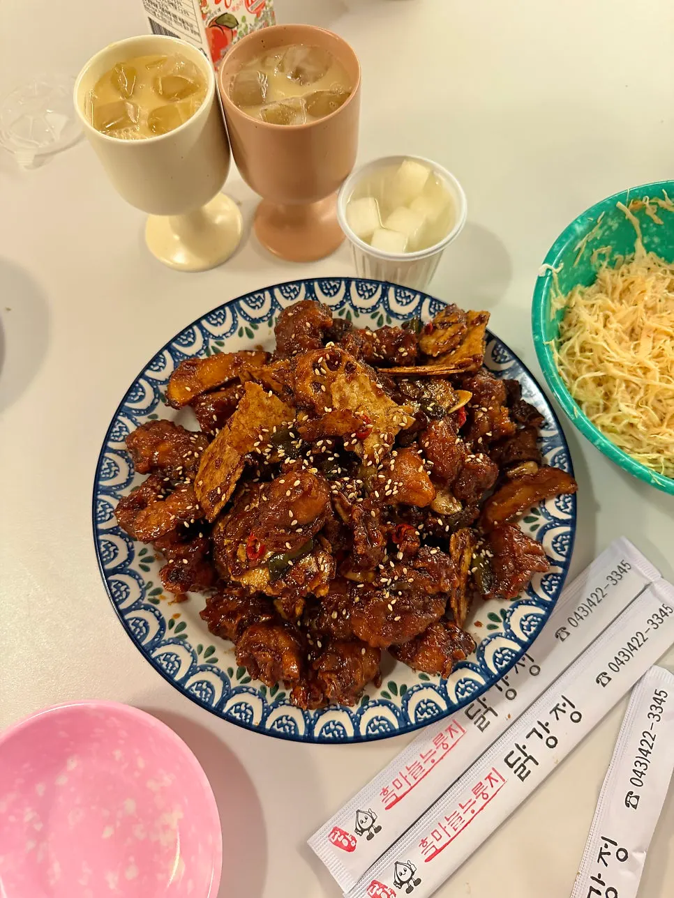 Dakgangjeong and black garlic makgeolli set out together