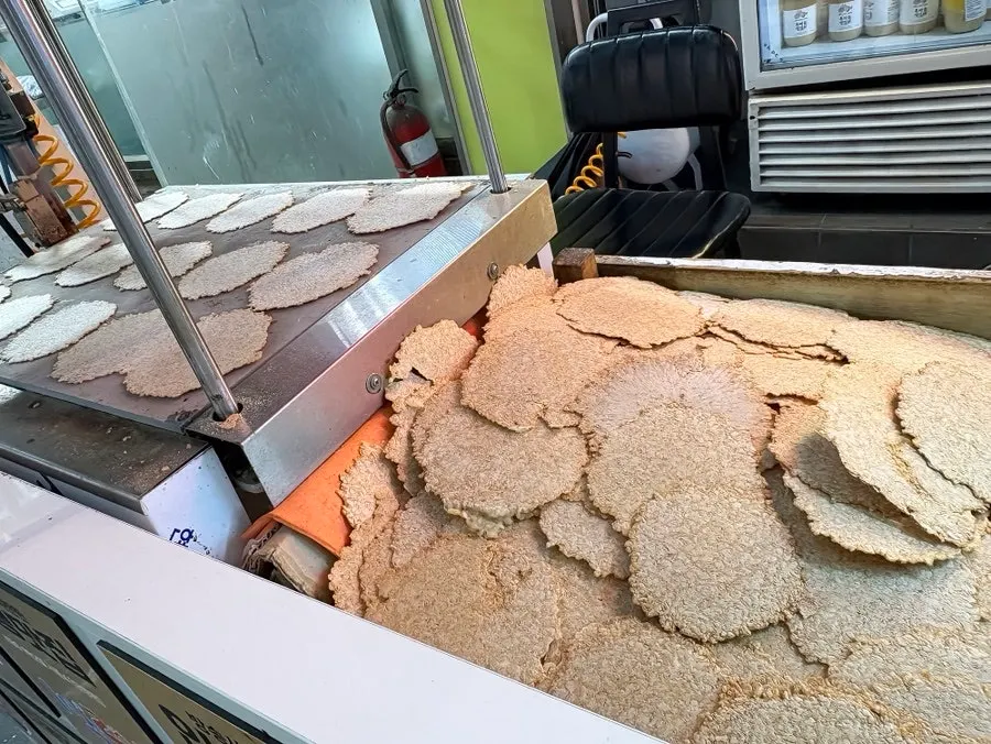 Machine making nurungji on one side of the store