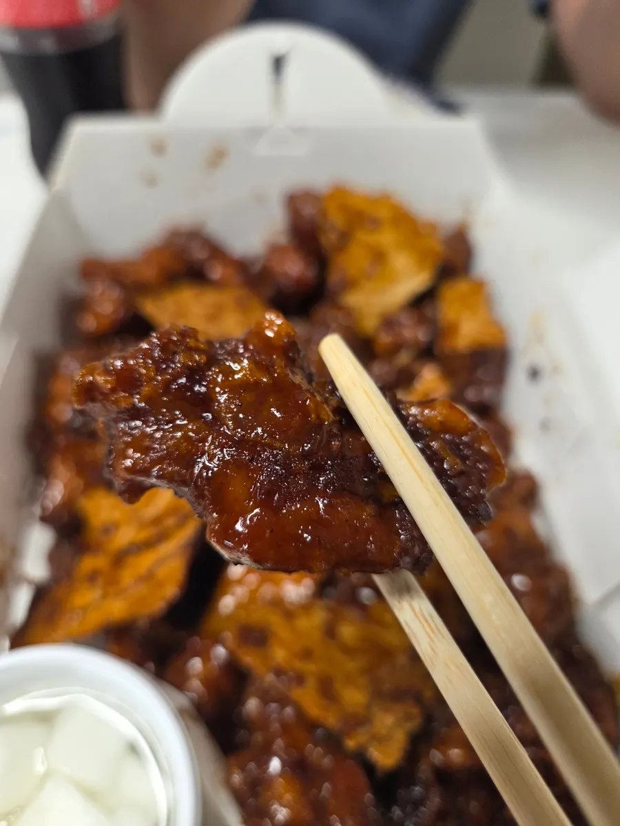 Piece of crispy nurungji mixed into the sauce