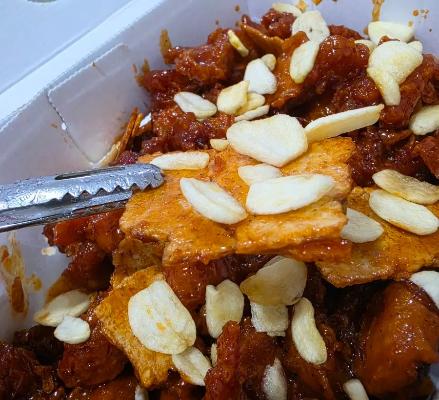 Close-up of crispy nurungji chips on the dakgangjeong