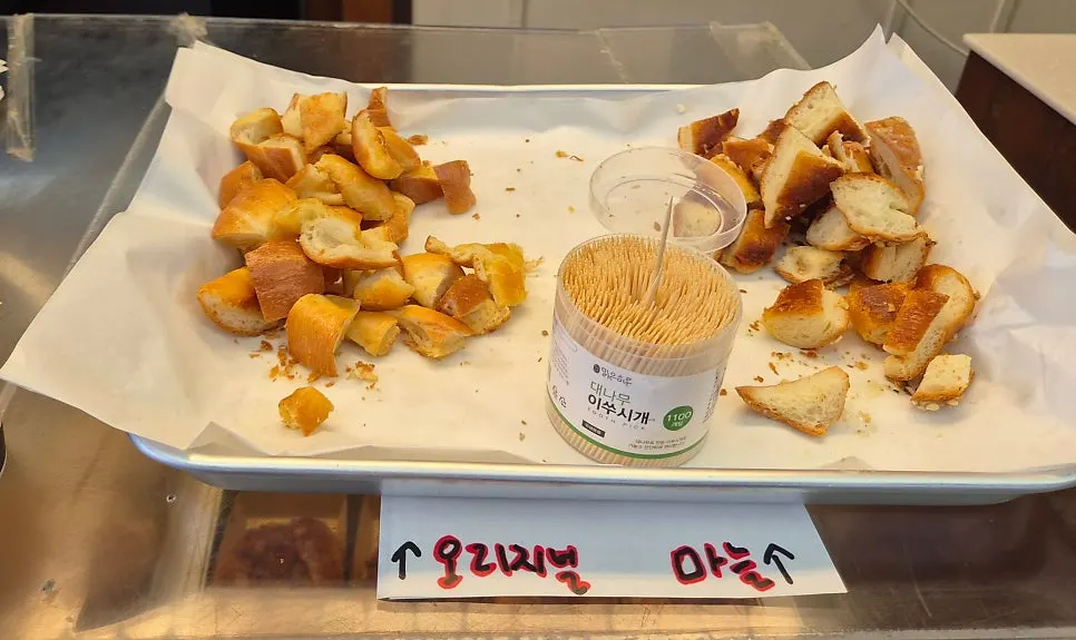 Tasting corner with original and garlic salt bread out front