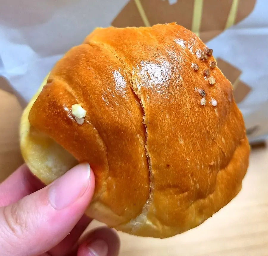 Cross-section of salt bread showing the crisp-outside, soft-inside texture