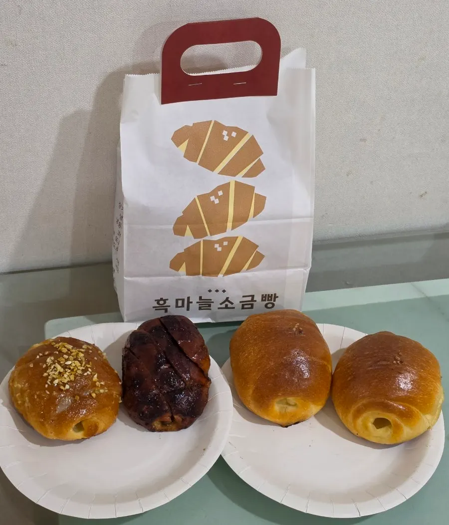 Garlic and black garlic salt bread in their own paper cases