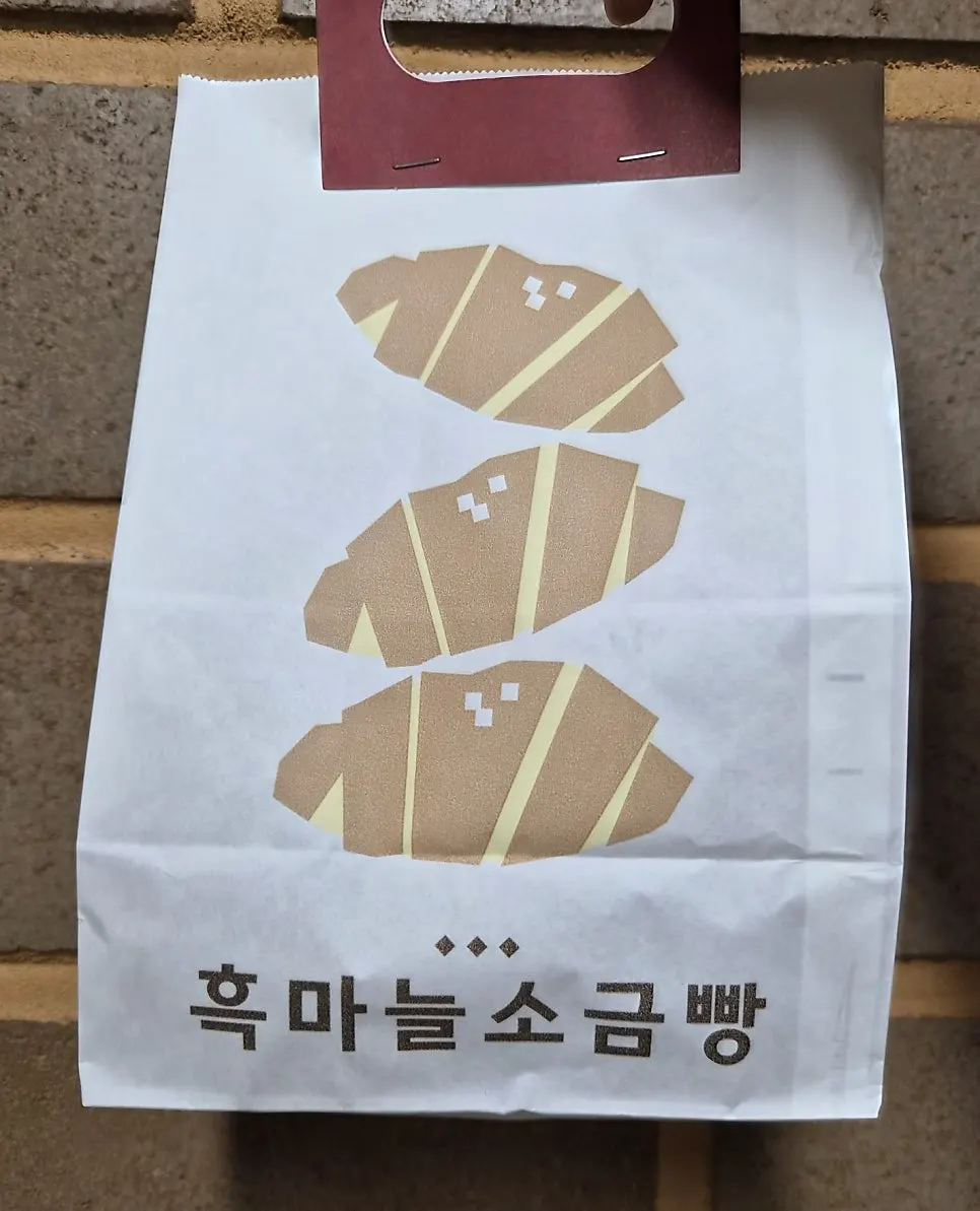 Four pieces of salt bread wrapped in paper