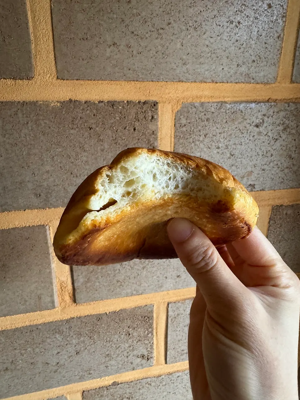 Cross-section of a black garlic salt bread cut in half