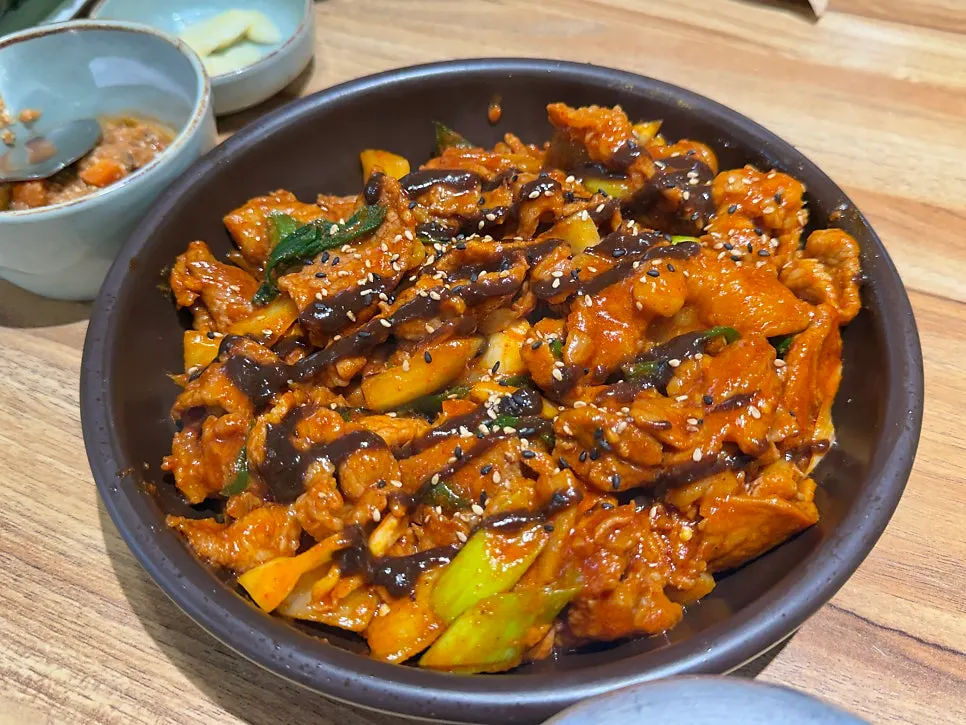 Table setting with doenjang stew and side dishes