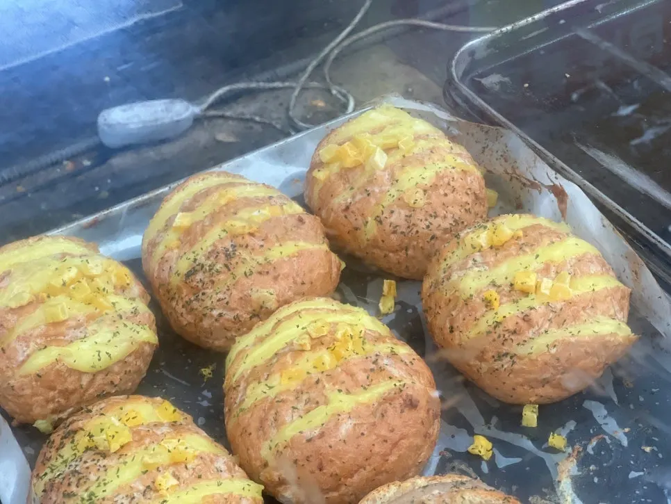 Two boxes of garlic bread packed to go, plus the oven reheating result: Danppang Bakery