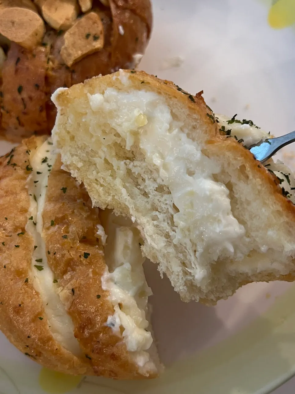 A piece of garlic bread reheated in the oven