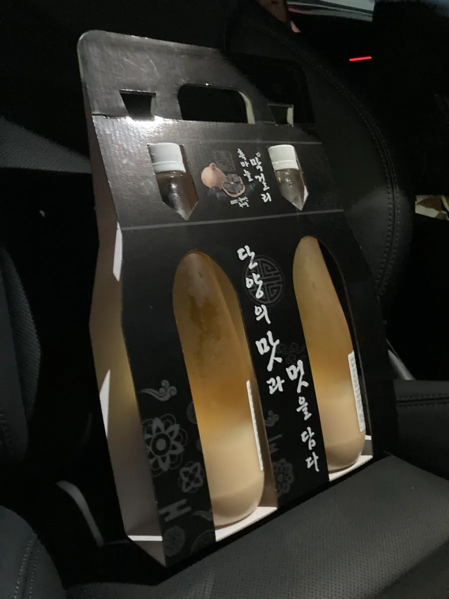 Black garlic makgeolli sold alongside the dakgangjeong