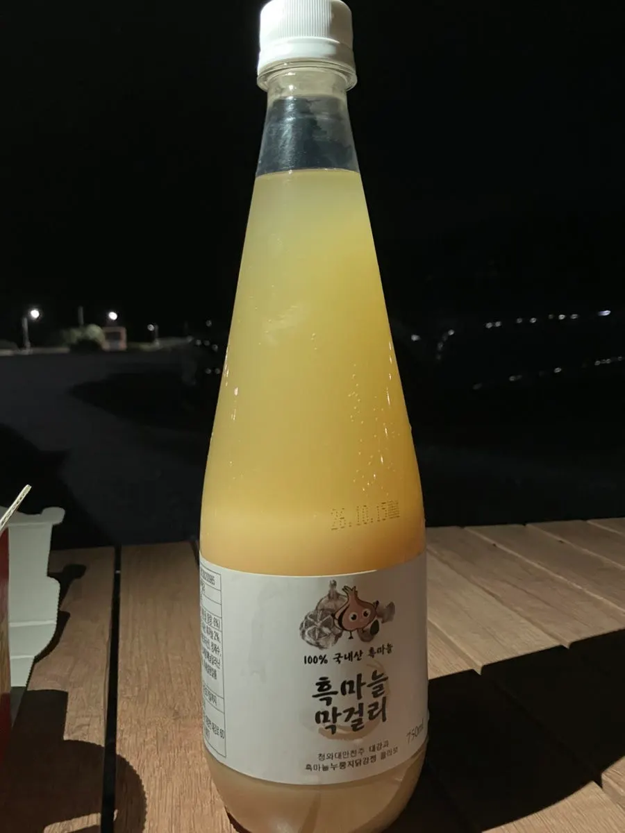 Bottle of black garlic makgeolli made from Danyang's specialty garlic