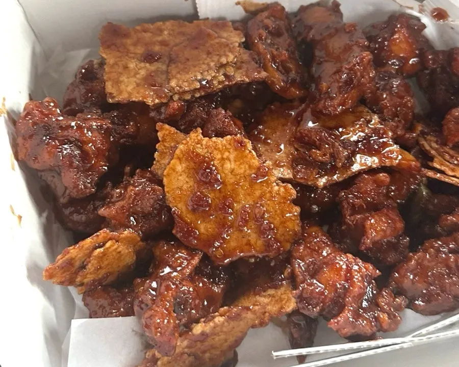 Fried chicken takeout box opened inside the car