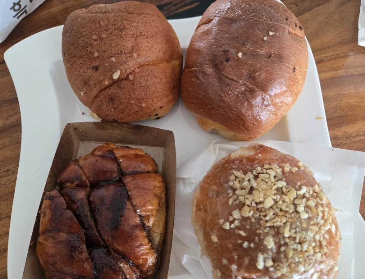 A bite of crispy-outside, moist-inside black garlic salt bread