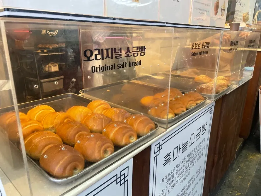 Display case of golden-brown salt bread