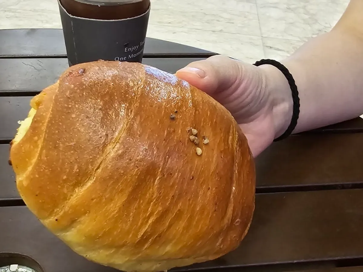 Danyang black garlic salt bread held in hand