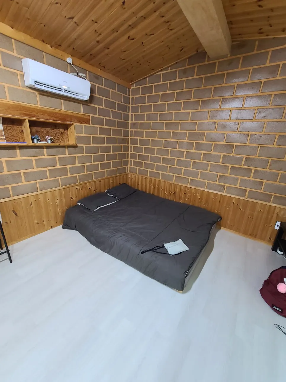Large clay bed on one side of the room