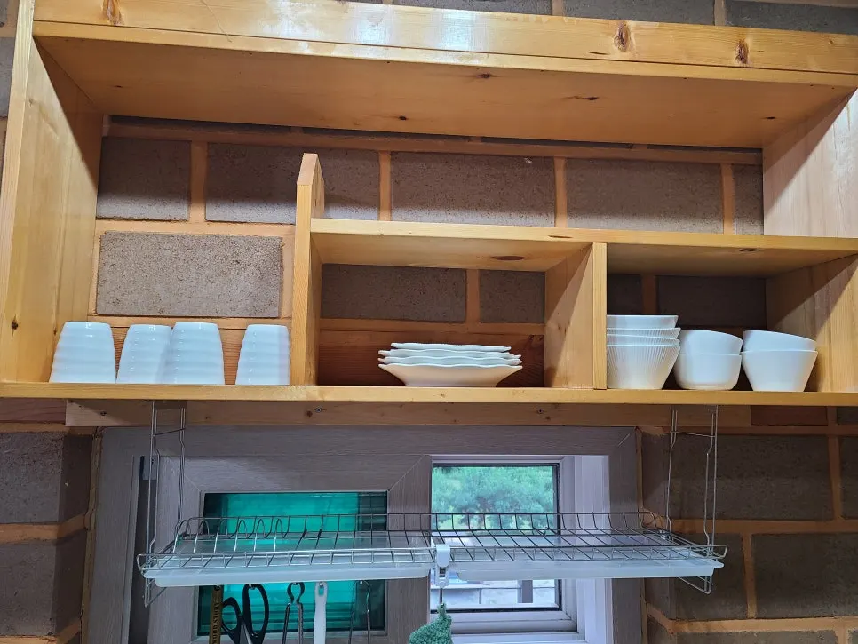 Room kitchen with microwave, electric kettle, and other appliances