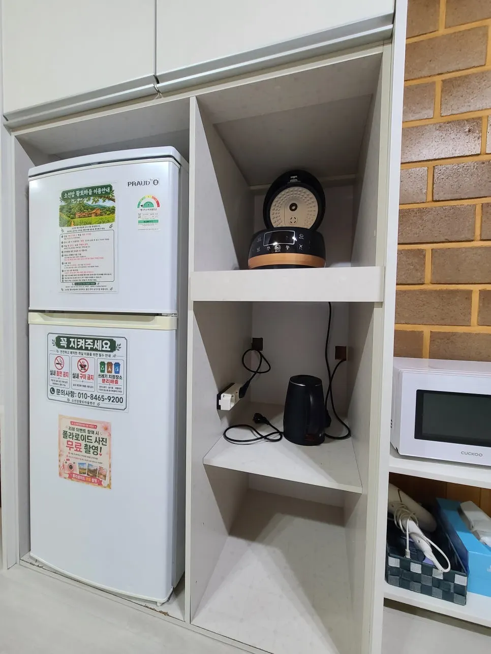 Dishes and cooking tools inside the kitchen cupboard