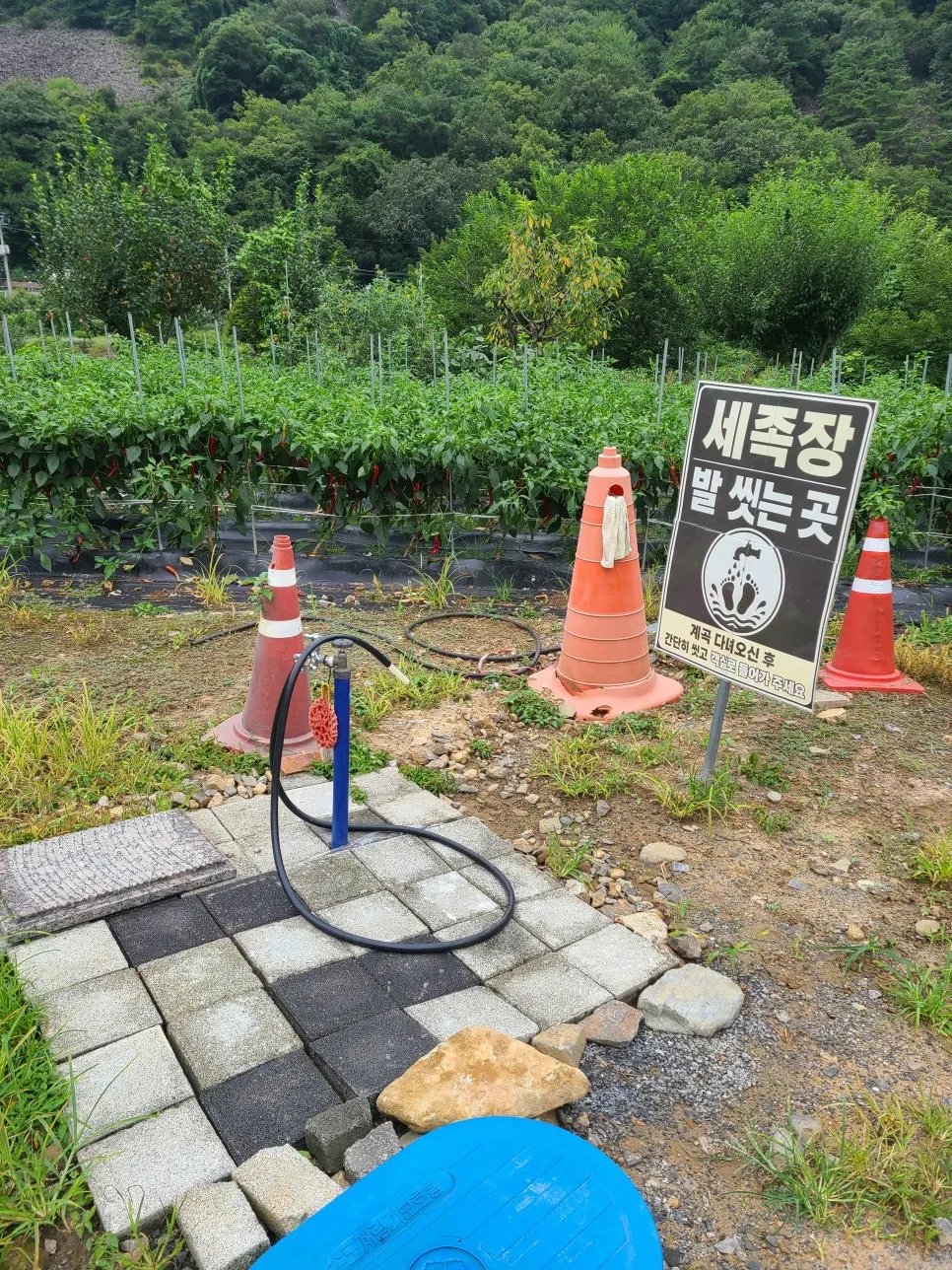 Foot-washing spot at the entrance and path to the valley