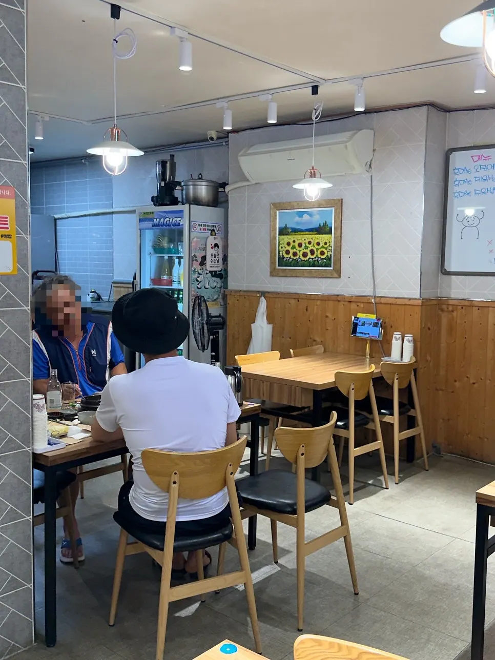 Interior of the restaurant decorated with wood-toned tables