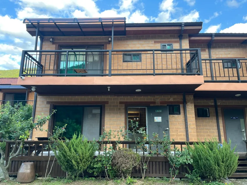 Exterior of Soseonam Hwangto Village Guesthouse built with red clay bricks
