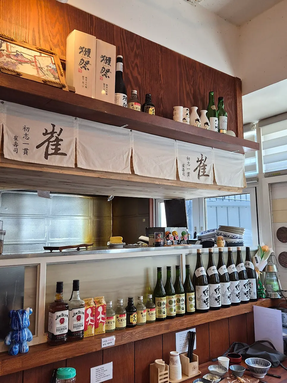 Wood-toned interior of Choejihun Sushi