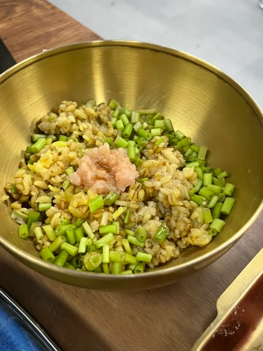 Roe-turmeric rice topped with water dropwort and salted roe