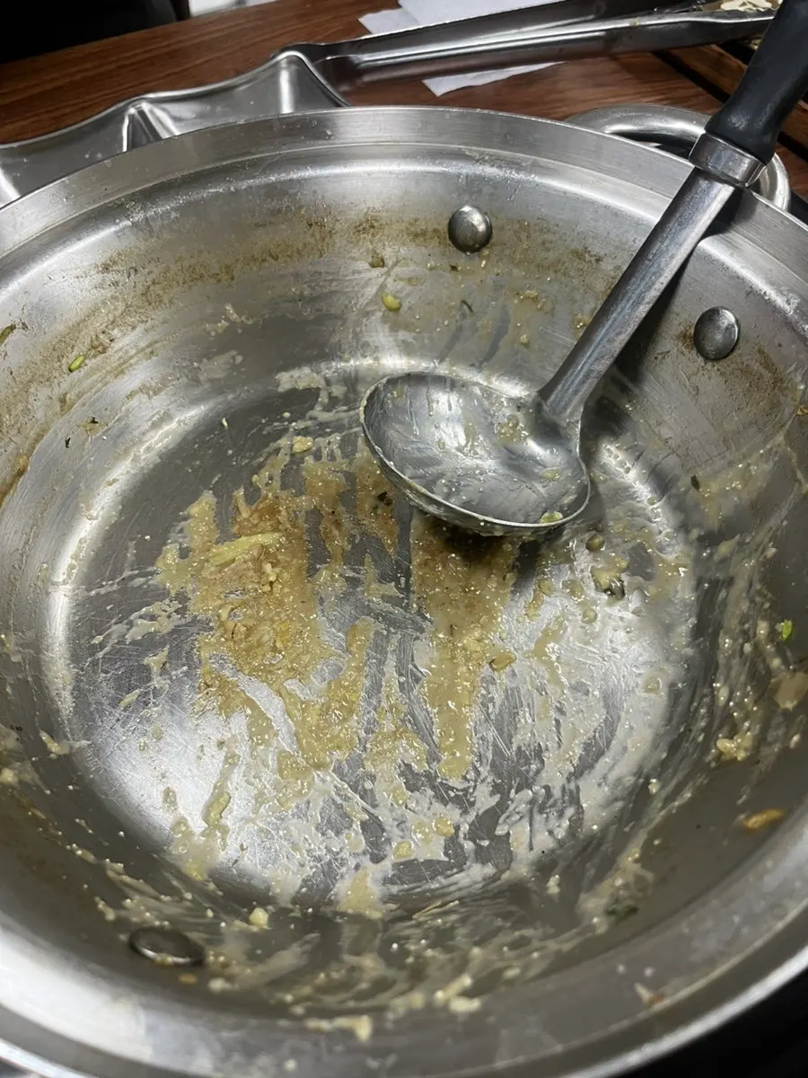 A finished bowl of roe-turmeric rice porridge