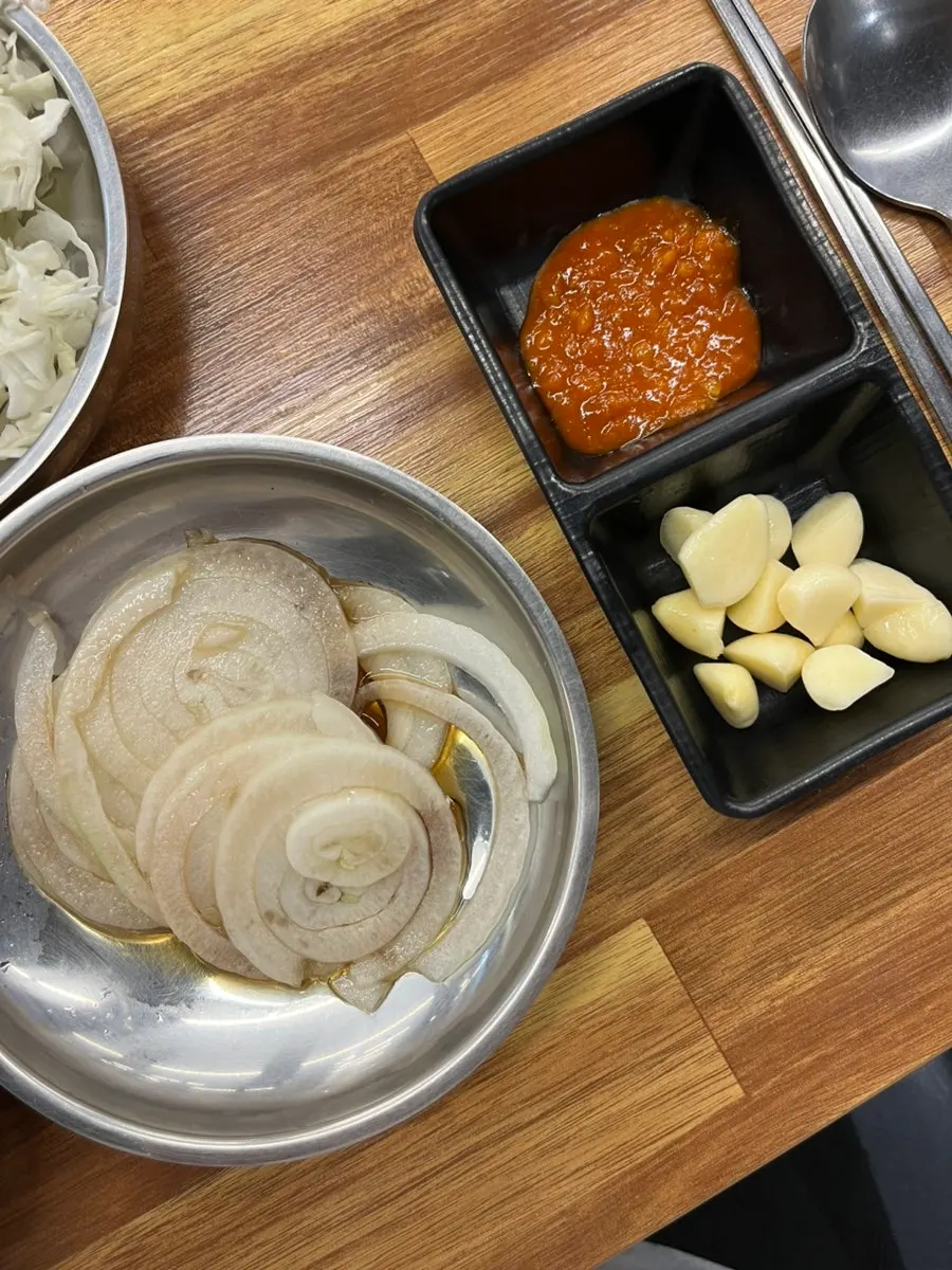 Pickled onions and scallion salad served with the pork ribs