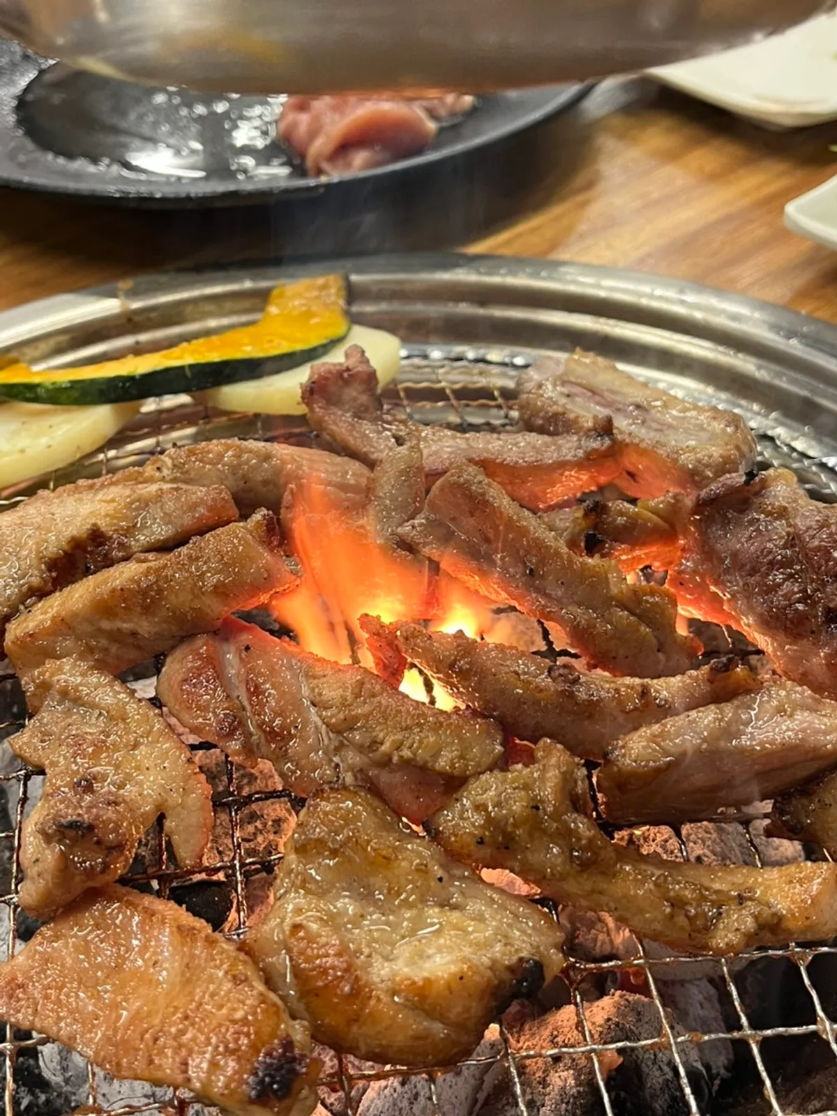 Golden-brown marinated pork ribs cooked at Dwaegal Gongmyeong Soba